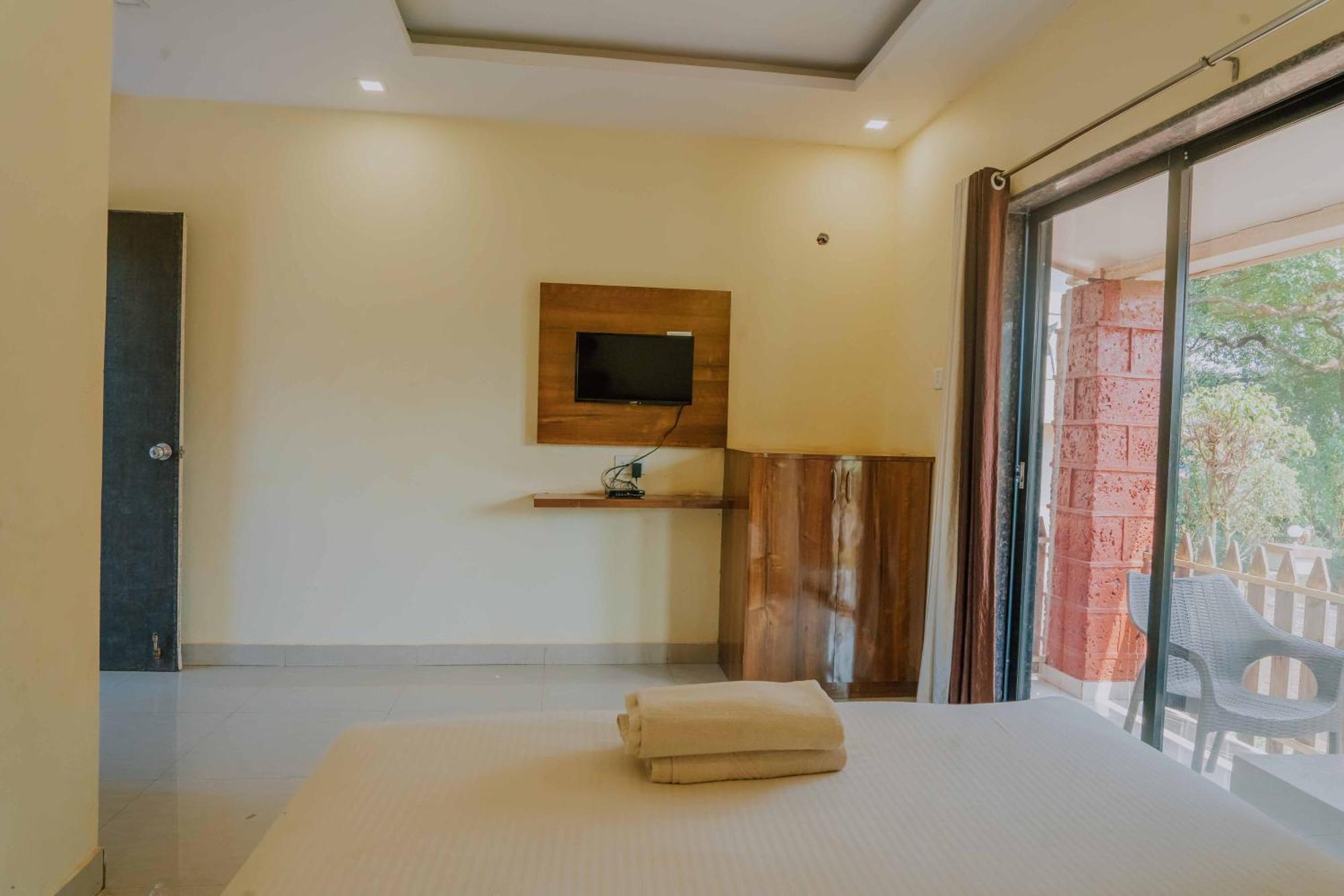 Hotel Oakwood Mahābaleshwar Стая снимка
